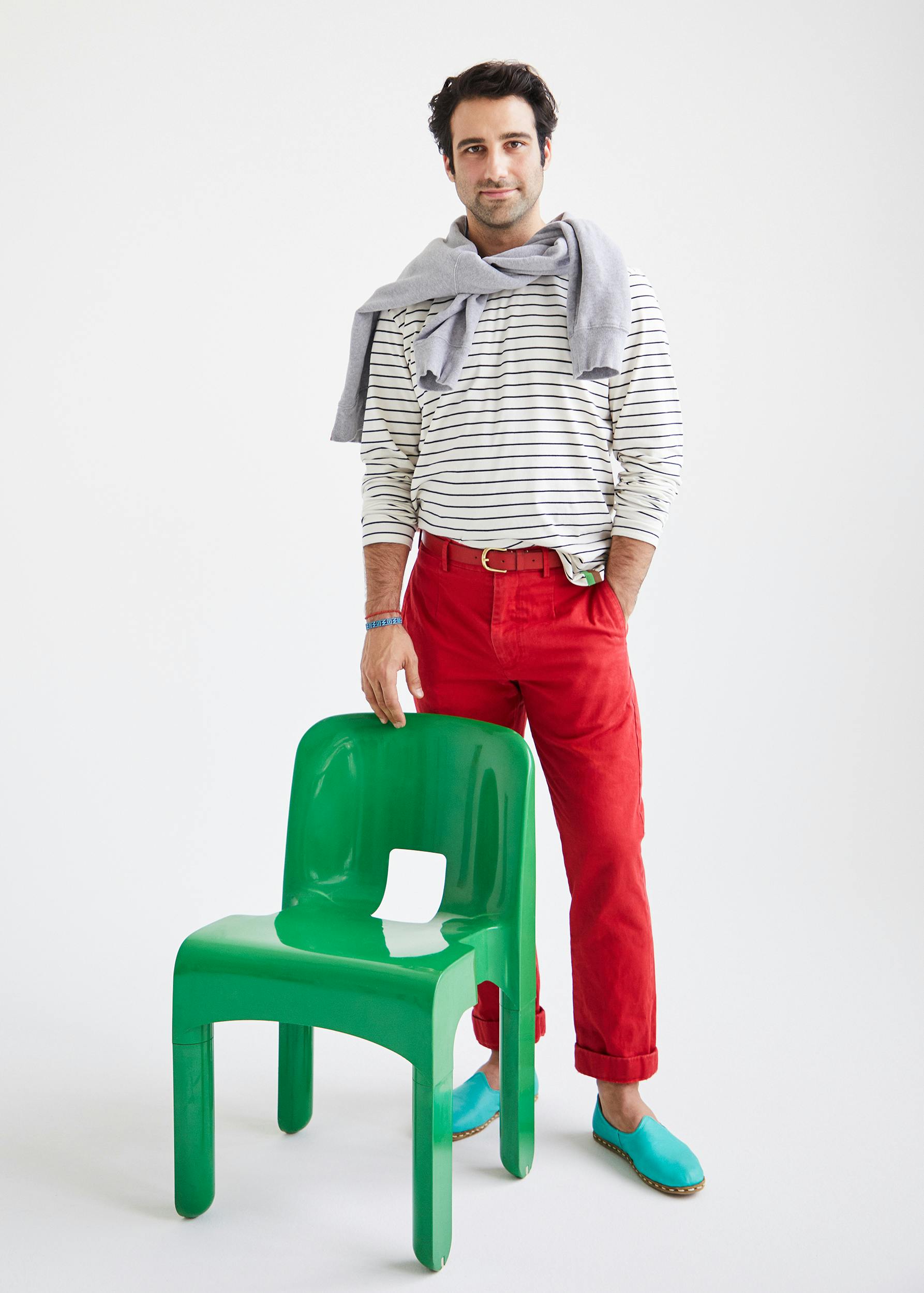 Cool stylish man in striped tee and red pants for a casual outfit